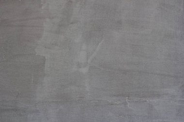 Çizgileri ve çizikleri olan bir inşaat işçisinin gri beton dokusu.
