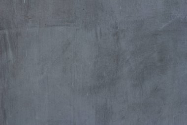 Çizgileri ve çizikleri olan bir inşaat işçisinin gri beton dokusu.