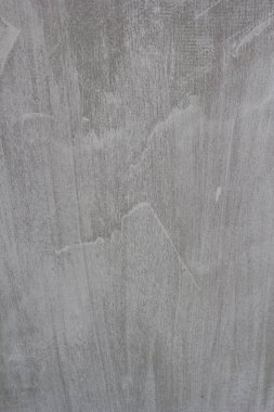 Çizgileri ve çizikleri olan bir inşaat işçisinin gri beton dokusu..