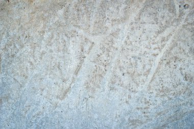 Çizgileri ve çizikleri olan bir inşaat işçisinin gri beton dokusu..