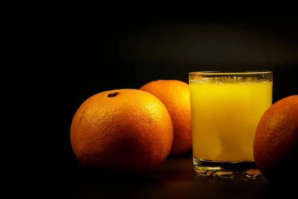 Fresh Orange Juice Glass Slices Oranges Black Background — 스톡 사진