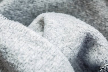 Makro görünümde ısınmak için giysi üzerindeki beyaz yün dokusu