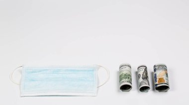 Sağlık maliyetinin bir göstergesi olarak, salgın hastalık ve karantina sırasında oluşan tıbbi maske..