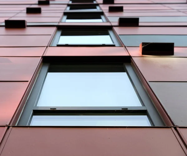 Dark red wall of apartment building in Redmond