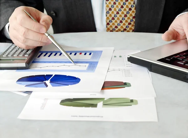 Businessman with charts — Stock Photo, Image