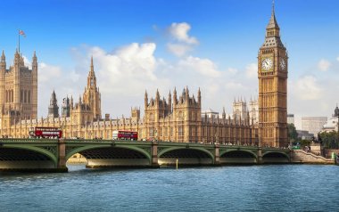 LONDON, UK - September 19, 2014: Big Ben and House of Parliament with traffic on Westminster bridge over the river Thames on a sunny day clipart