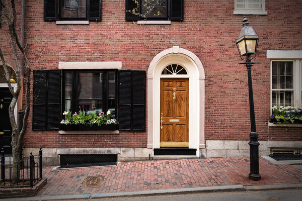 Old brick brick house with beautiful door and window
