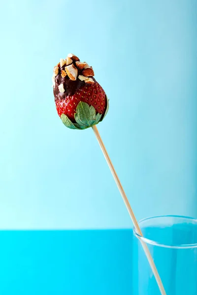 Strawberry with chocolateand nuts — Stock Photo, Image