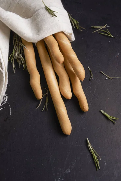 Breadsticks on dark background — Stock Photo, Image