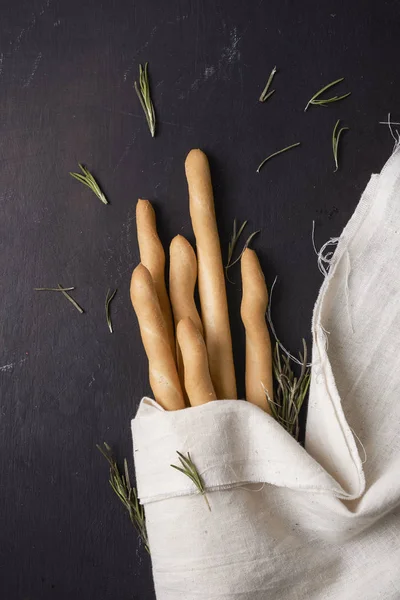 Breadsticks on dark background — Stock Photo, Image