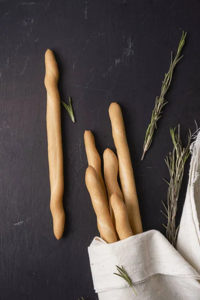Breadsticks on dark background — Stock Photo, Image