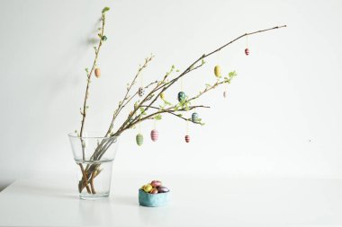 twigs decorated ccolors eggs