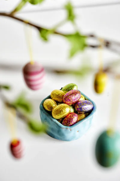 Chocolate eggs with easter decorations — Stock Photo, Image