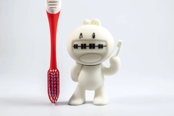 Bir diş telleri bebek ve diş fırçası. Stok Fotoğraf