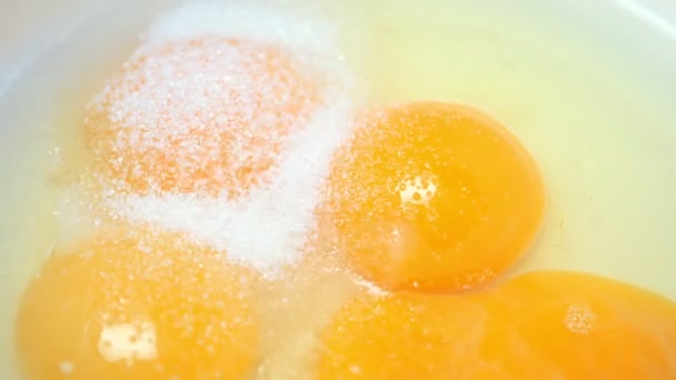 Sugar falls on broken eggs. Cooking biscuit.Slow motion — Stock Video