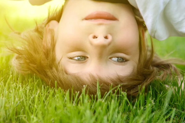 little boy standing upside down