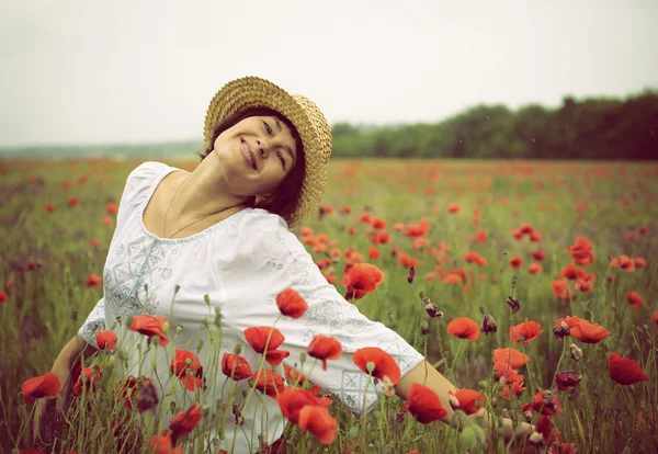 Cheerful woman in straw hat — Stock Photo, Image