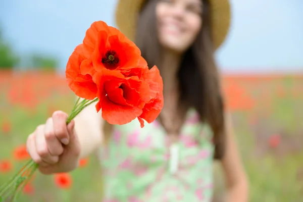 Woman with bunch of poppy — Stock Photo, Image