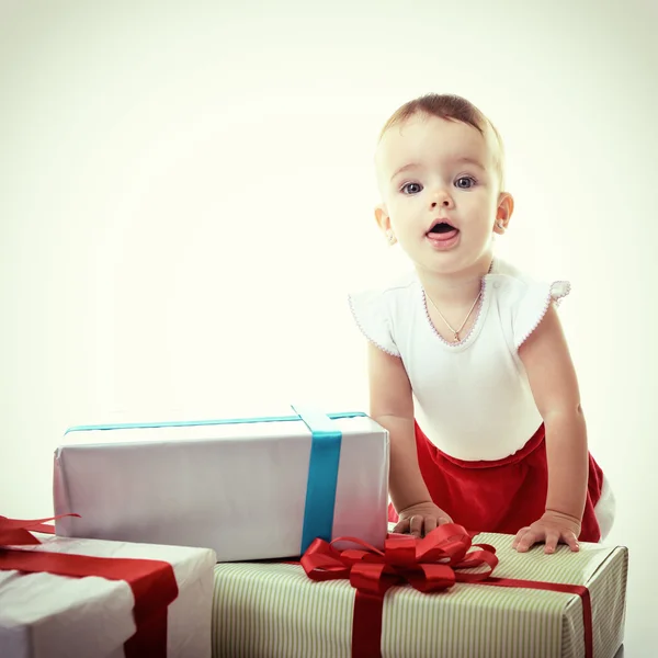 Baby girl with presents — Stock Photo, Image