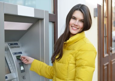 woman withdrawing money clipart