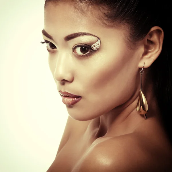 Woman with golden makeup — Stock Photo, Image