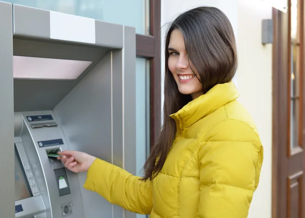 Woman withdrawing money — Stock Photo, Image