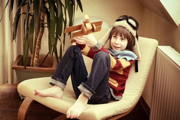 Boy playing with plane — Stock Photo, Image