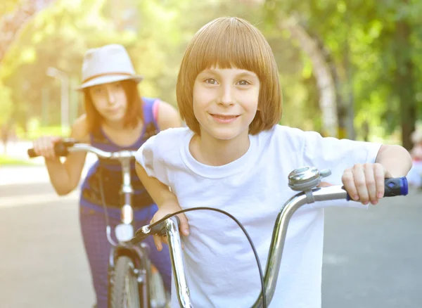 Children with bike in park — Stock Photo, Image