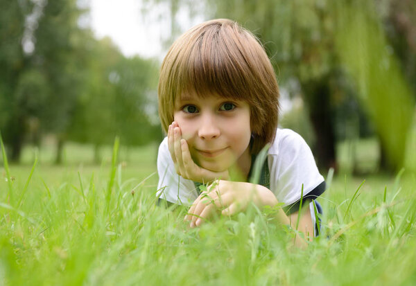 little boy in grass