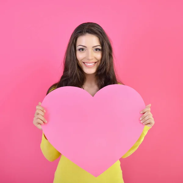 Woman holding pink heart — Stock Photo, Image