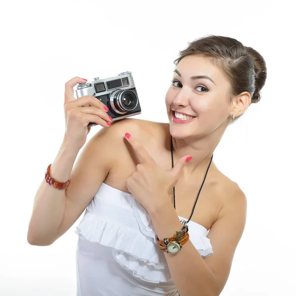 Mujer sosteniendo cámara retro en estudio —  Fotos de Stock