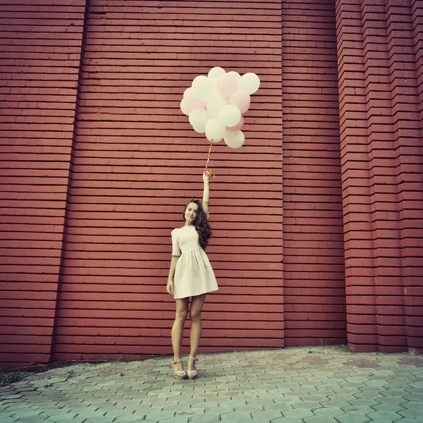 Mujer joven con globos —  Fotos de Stock