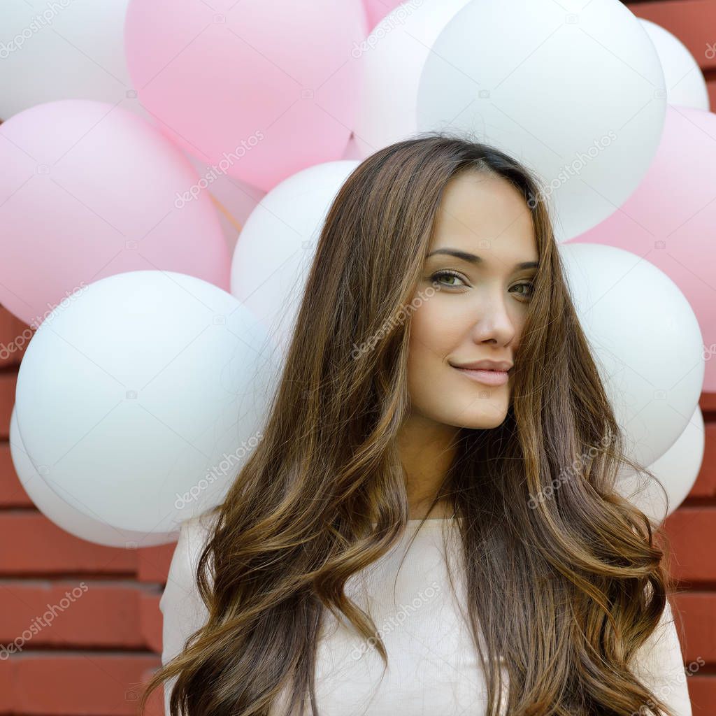 Young woman with balloons