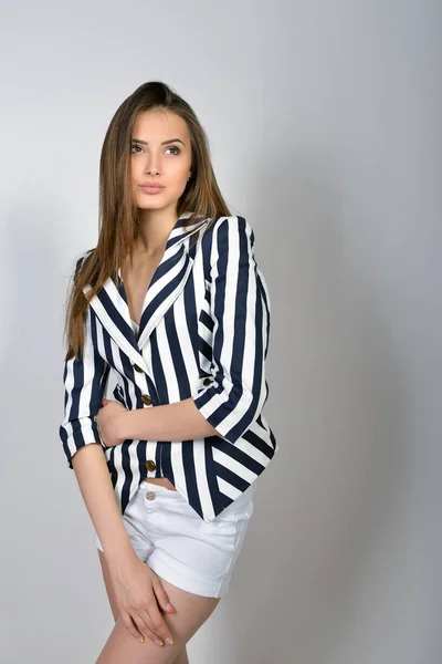 Brunette woman in striped jacket — Stock Photo, Image