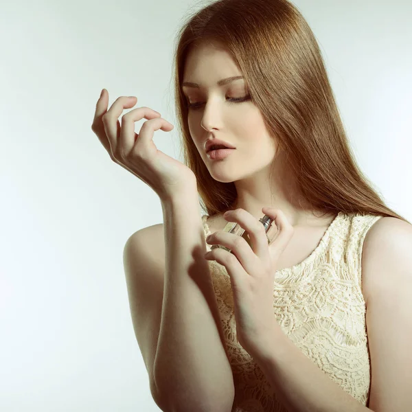 Beautiful Lady holding perfume — Stock Photo, Image