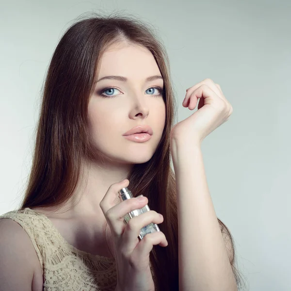 Beautiful Lady holding perfume — Stock Photo, Image