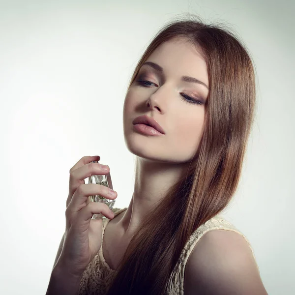 Lady holding bottle of perfume — Stock Photo, Image