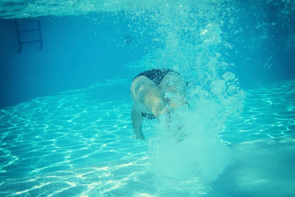 female swimming in pool