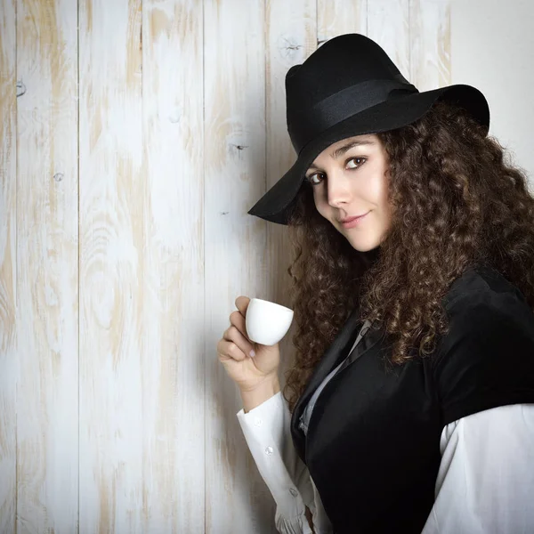 Beautiful woman in black hat — Stock Photo, Image