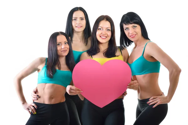 Fitness vrouwen met roze hart — Stockfoto