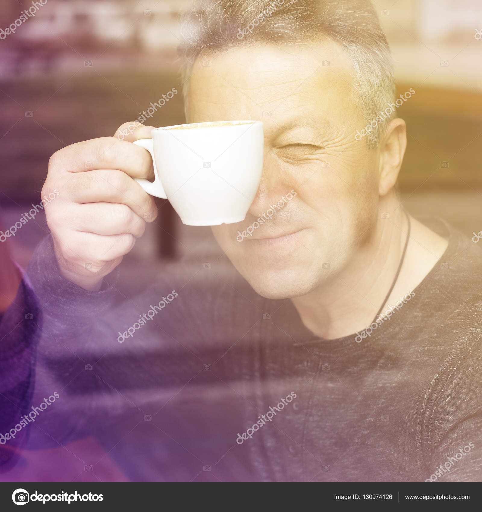 Man drinking coffee in cafe — Stock Photo © khorzhevska #130974126
