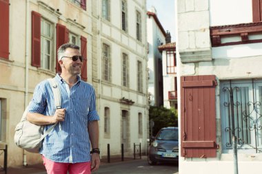 Orta yaşlı adam yürüyüş şehir