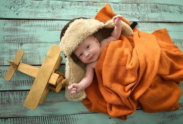 Baby boy aviator with pilot scarf and hat and handmade toy airpl — Stock Photo, Image