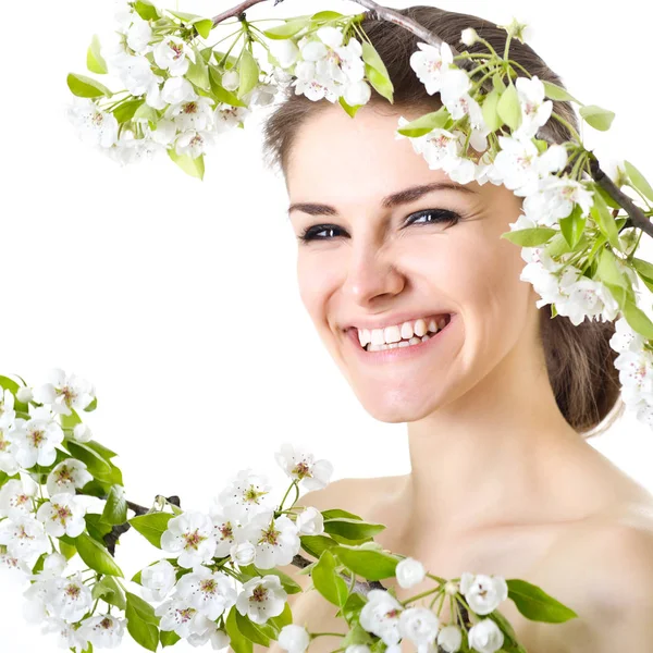 Beauty woman with flowering branches — Stock Photo, Image