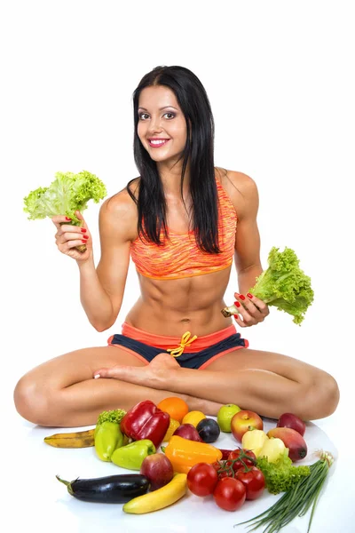 Mulher fitness com conjunto de legumes — Fotografia de Stock