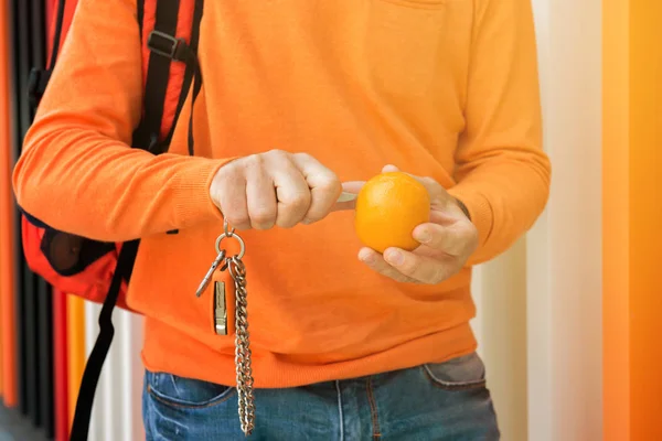 Man in orange sweater — Stock Photo, Image