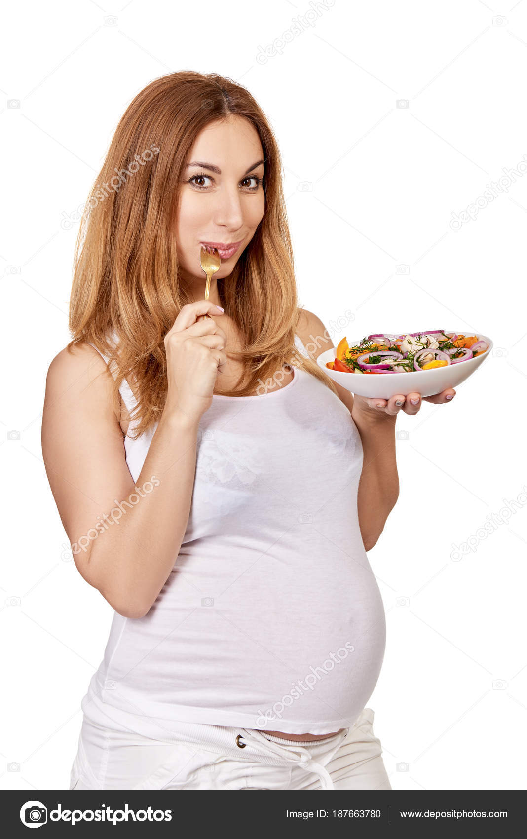 Pregnant woman. Portrait of eating pregnant lady posing in studi ... Pregnant woman. Portrait of eating pregnant lady posing in studi ...
