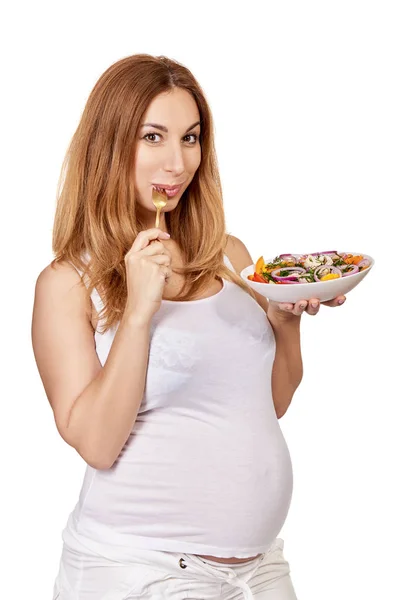 Uma mulher grávida. Retrato de comer senhora grávida posando em studi — Fotografia de Stock