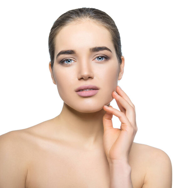 Beauty female portrait. Beautiful young woman posing over white 