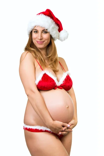 Gravid kvinna som väntar barn. Christmas gravid kvinna poserar — Stockfoto